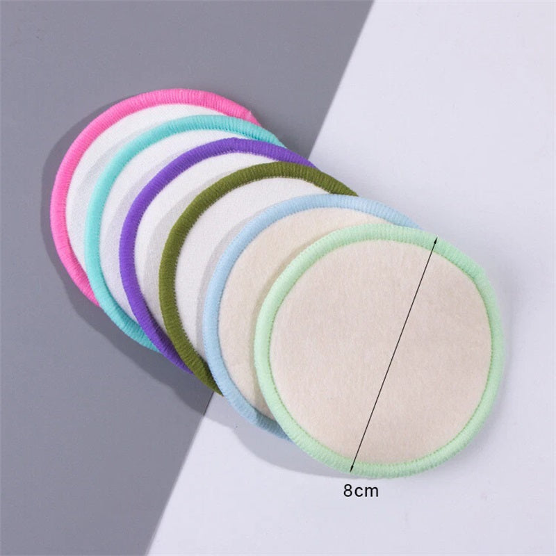 Stack of round microfiber makeup remover pads with multicolor stitched borders