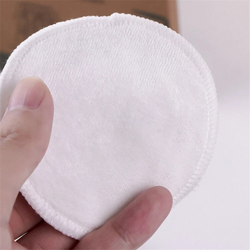 Round white microfiber makeup remover pad with stitched edge
