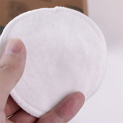 Round white microfiber makeup remover pad with stitched edge