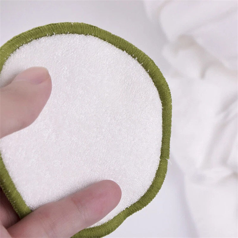Round microfiber makeup remover pad with white center and green border