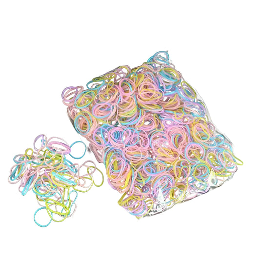 Pastel multicolor disposable hair elastics in a loose pile