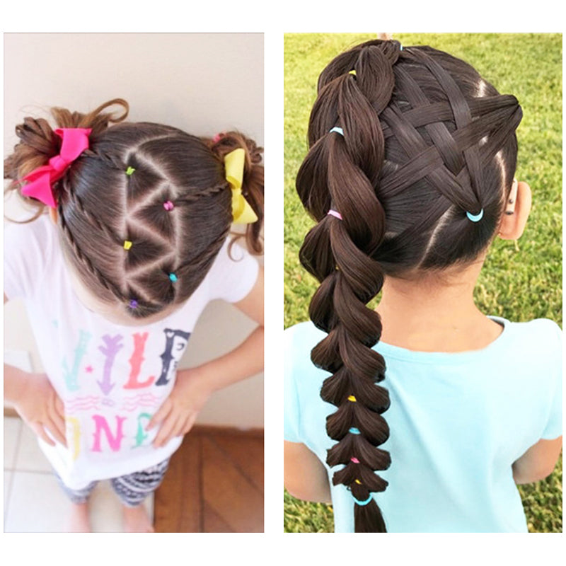 Colorful hair elastics securing braided ponytails on children’s hair
