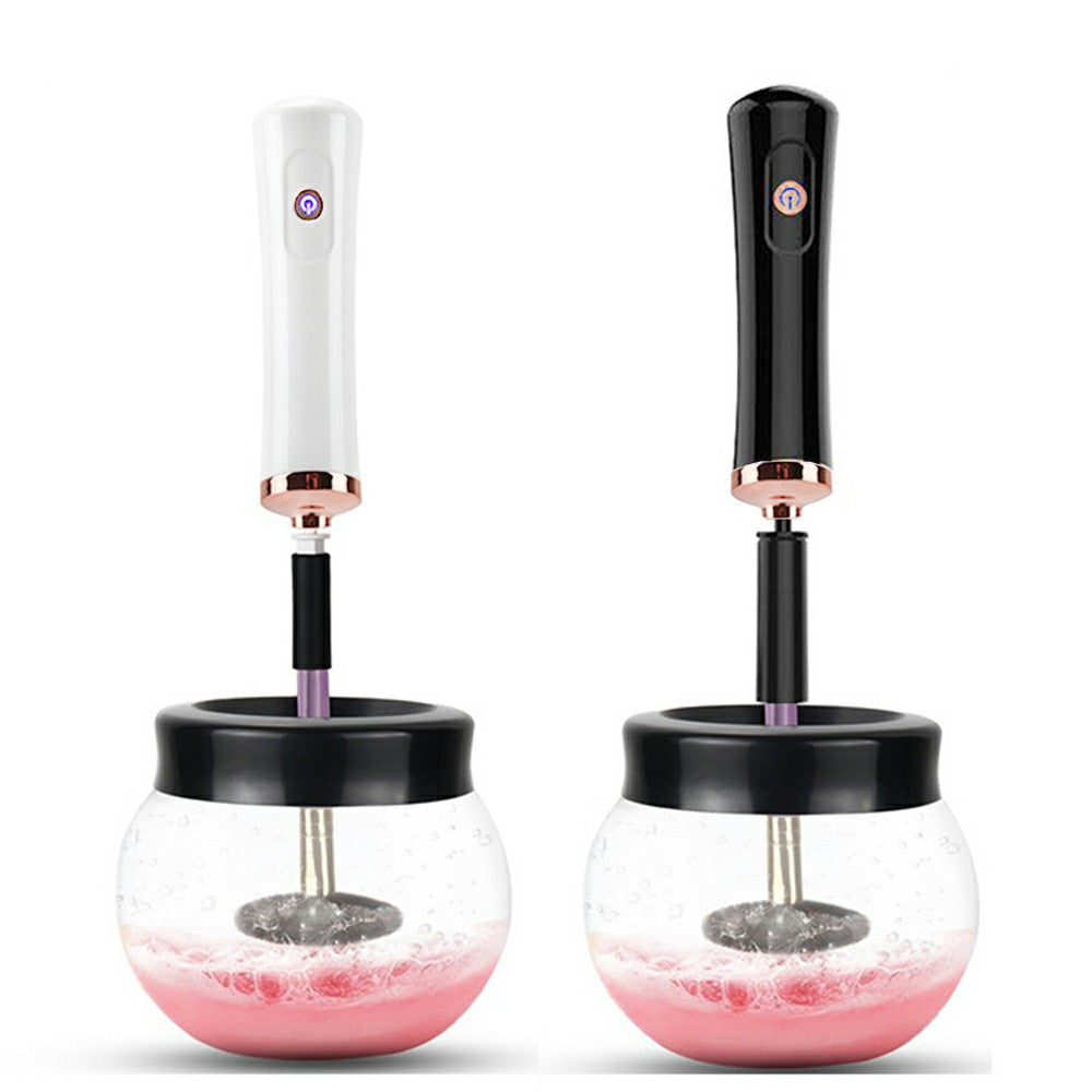 Two makeup brush cleaner dryers, white and black handles with clear pink-water bowls
