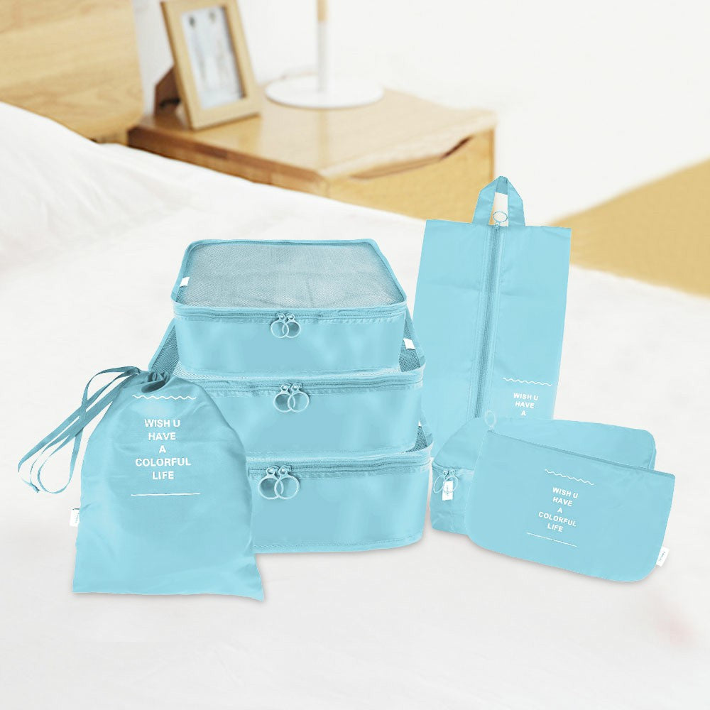 Blue waterproof travel packing cubes set with zip closures and small pouches, 7 pieces
