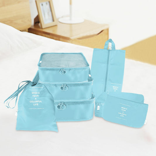 Blue waterproof travel packing cubes set with zip closures and small pouches, 7 pieces