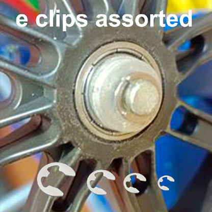 Stainless steel E-clip set with several retaining clips near a shaft
