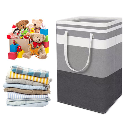Folding laundry hamper bag in grey stripes with front handles next to folded laundry