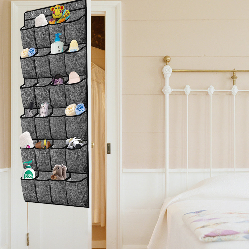Hanging shoe organizer in use with gray pocket compartments holding small shoes and accessories