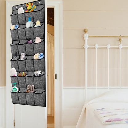 Hanging shoe organizer in use with gray pocket compartments holding small shoes and accessories