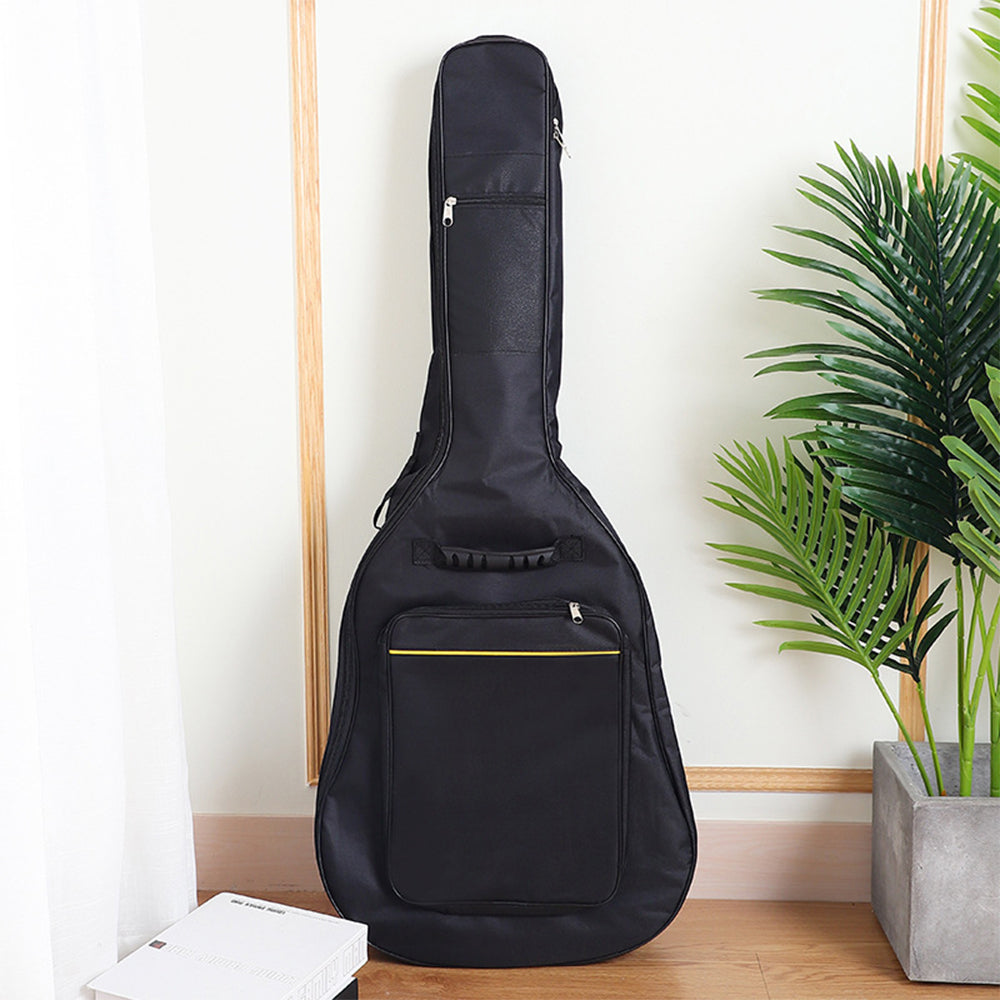 Black padded acoustic guitar gig bag with zippered front pocket and side zipper