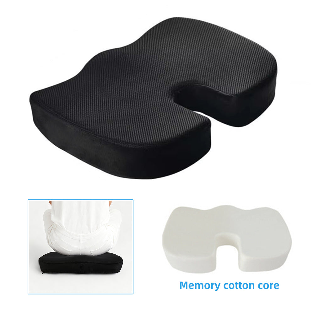 Black ergonomic seat cushion with coccyx cutout and visible foam core shape