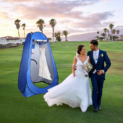 Blue pop-up shower changing tent with open front privacy panel beside a wedding couple
