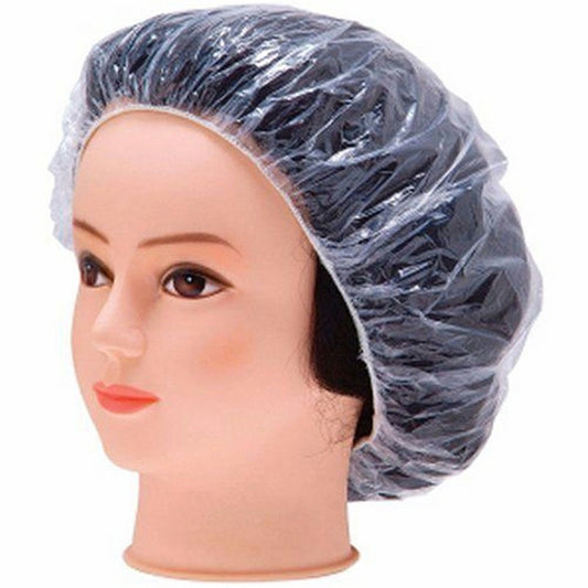 Disposable transparent shower cap on model head, covering hairline and ears