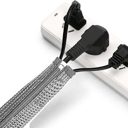 Grey braided cable organizer sleeve with zipper, holding connected power and data plugs