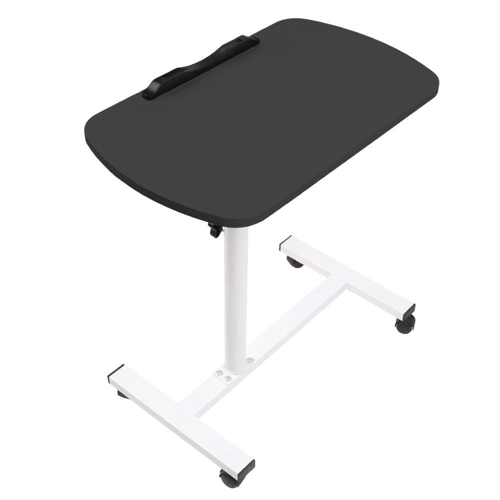 Adjustable overbed table with black tabletop and four caster wheels on white base