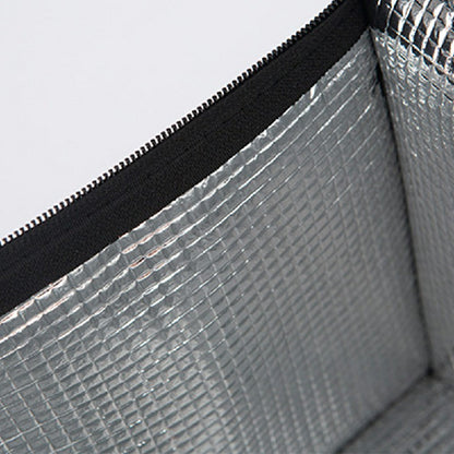 Silver reflective insulated interior lining inside black thermal bag