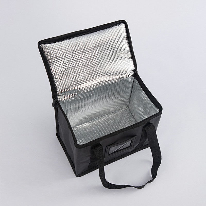 Black thermal bag open showing silver reflective insulation and front carry strap