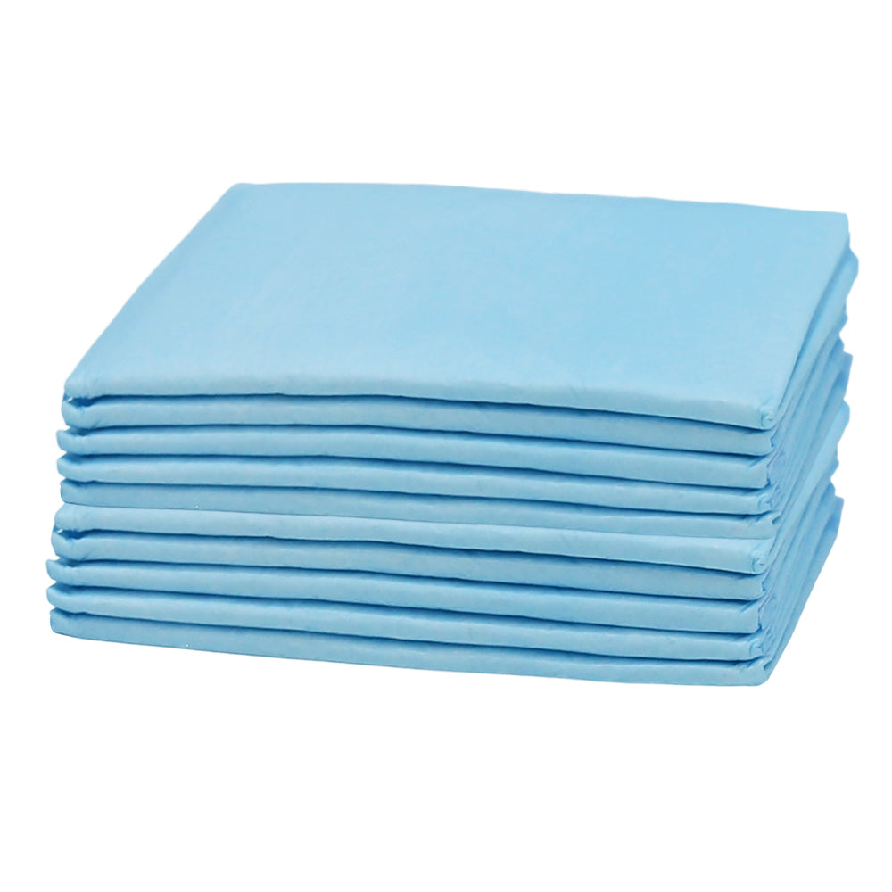 Stack of blue puppy training pads with multiple folded layers