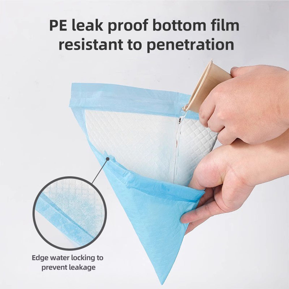 Corner of blue leakproof puppy pad with hand lifting the edge
