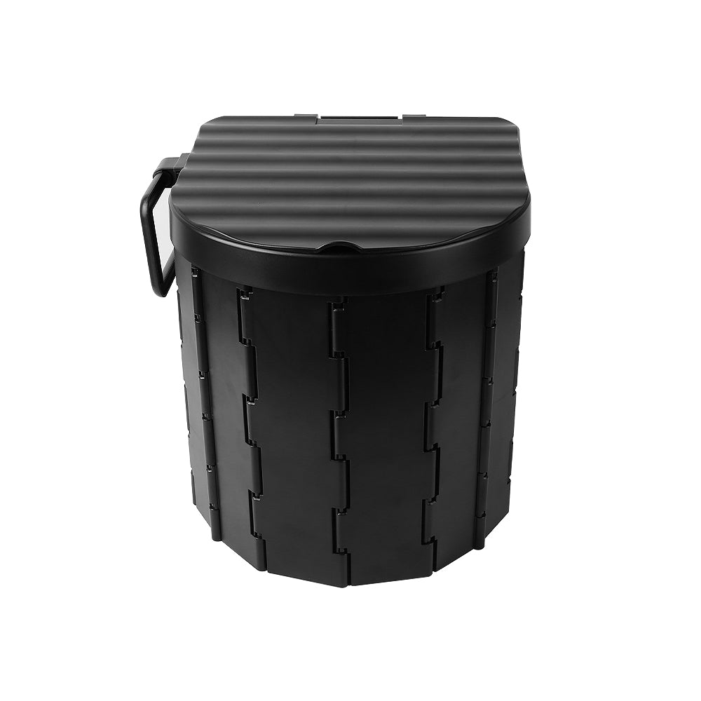 Folding portable toilet with black ribbed lid and upright waste bucket, carry handle