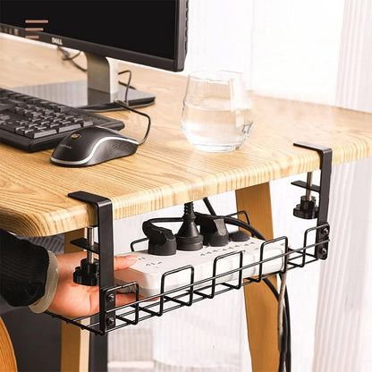 Black under-desk cable tray holding power adapters and cables