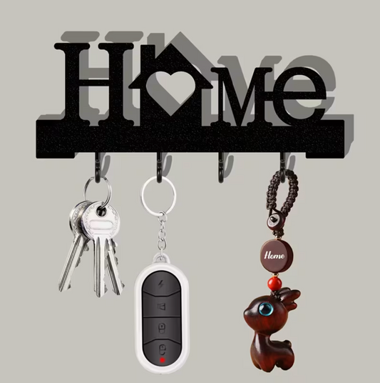 Black wall-mounted key organizer with heart motif and four hooks holding keys and fob