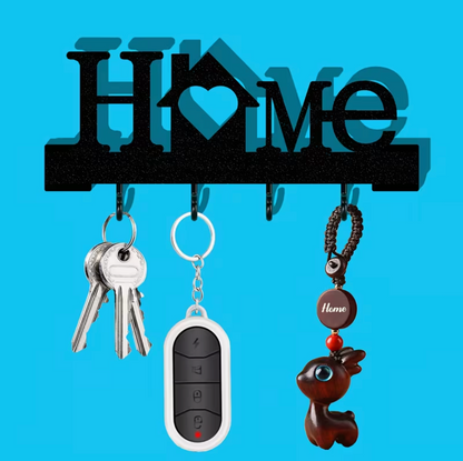 Black wall-mounted entry key organizer with heart motif and four hooks for keychains