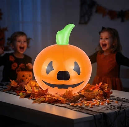Orange inflatable pumpkin with jack-o’-lantern face and green curling stem