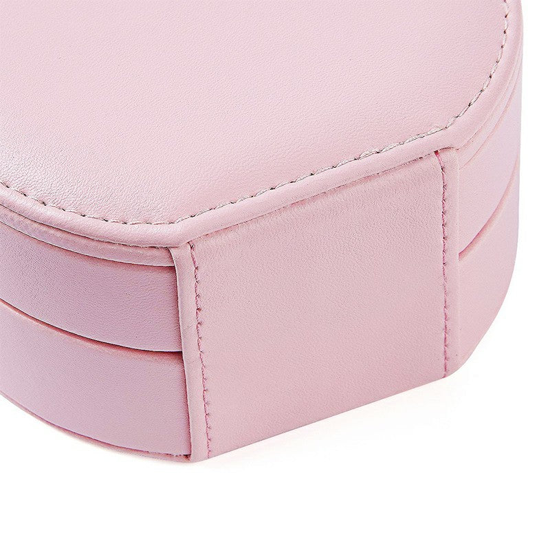 Pink round PU leather jewelry box with stitched side panels and curved lid seam