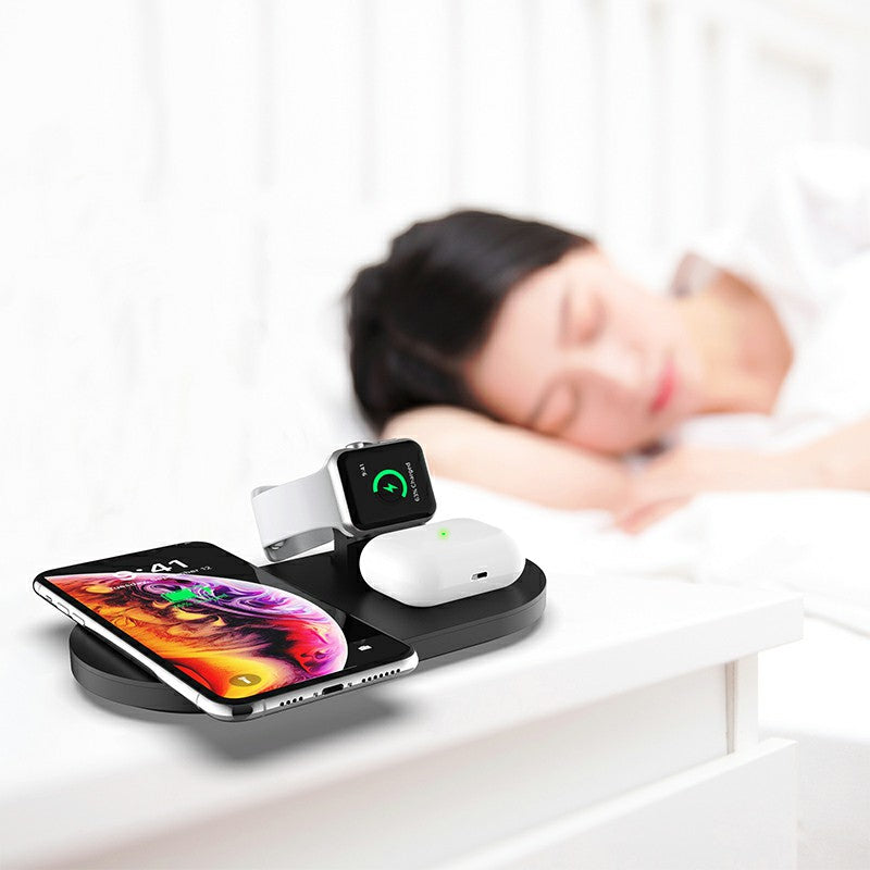 3-in-1 wireless charger station with black base, smartphone, earbuds, and smartwatch stand