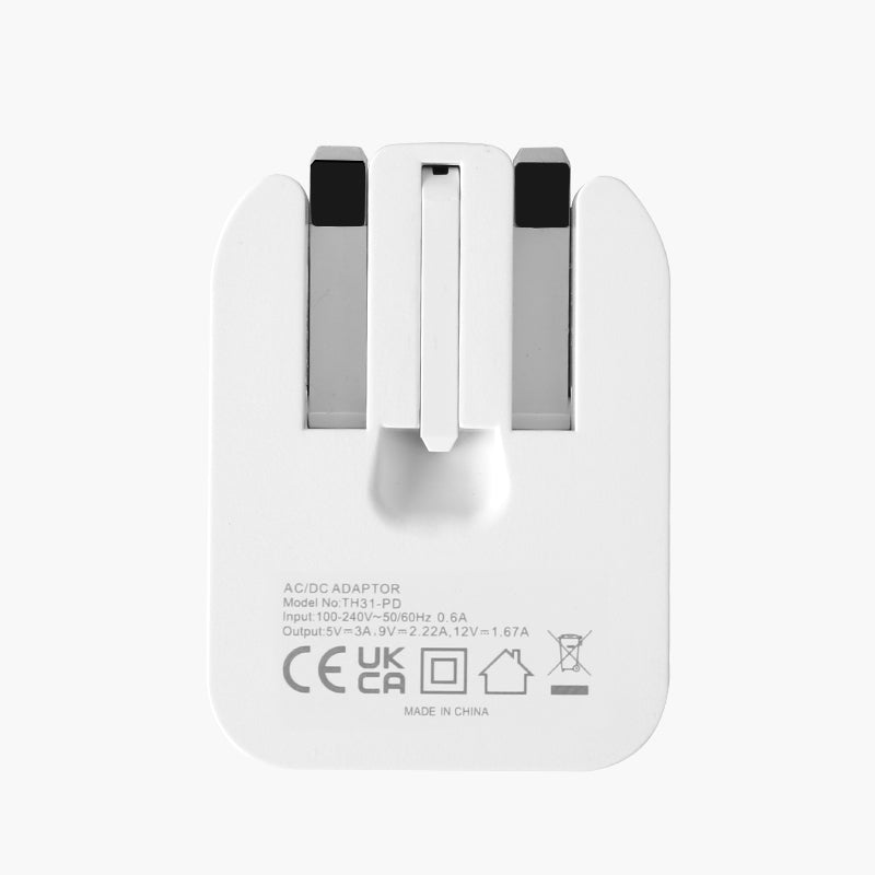 White foldable mains AC adapter with plug prongs and port markings on back