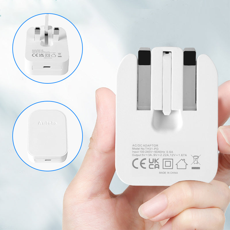White foldable mains AC adapter back view with USB-C port and prongs close-up
