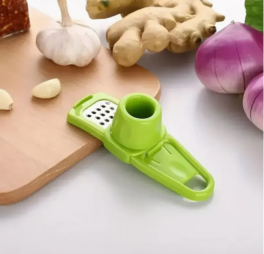 Green manual garlic press with grater plate and handle, compact kitchen chopper