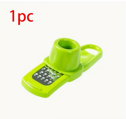 Green manual garlic press and grinder with grater opening, single-piece tool