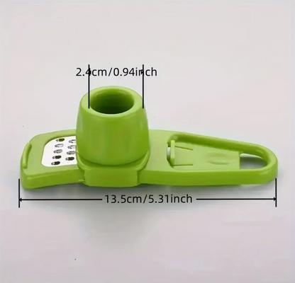 Green manual garlic press grinder, compact dimensions shown with cup and handle