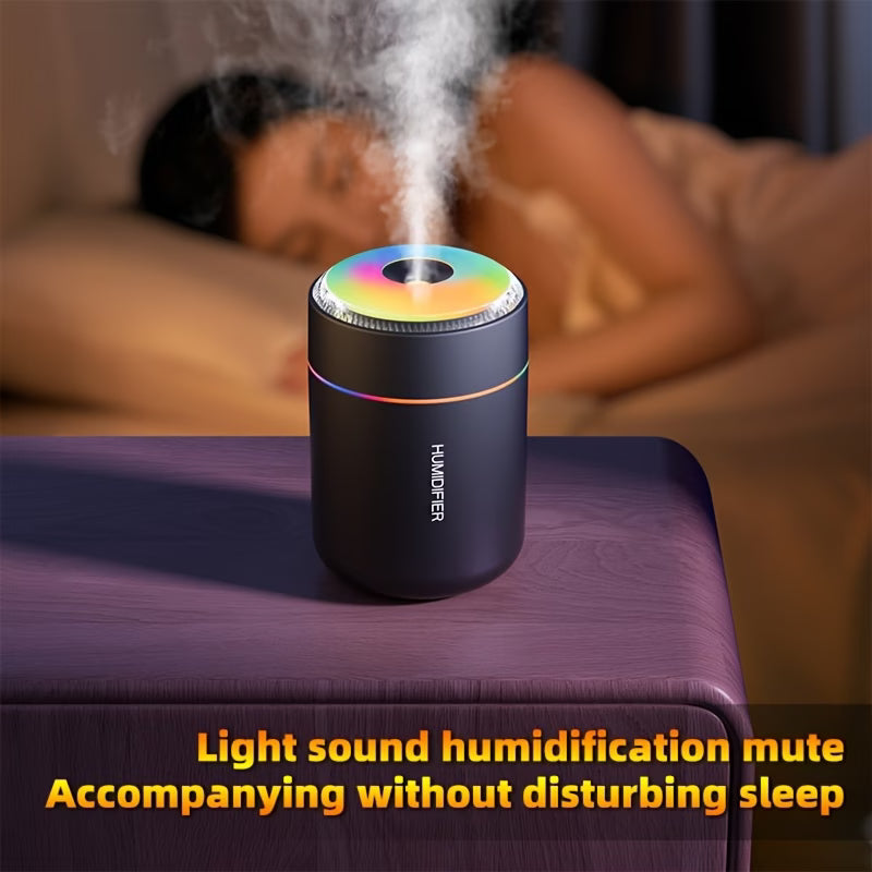 Mini humidifier with rainbow LED top and fine mist, compact dark cylinder