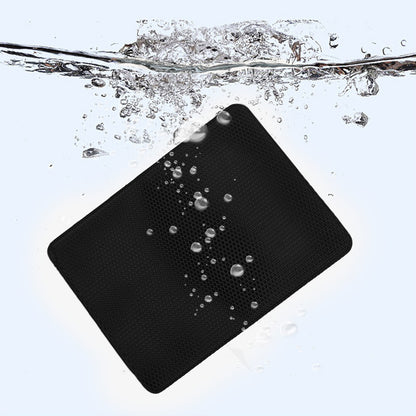 Black cat litter mat with water-beading surface, raised texture and visible droplets