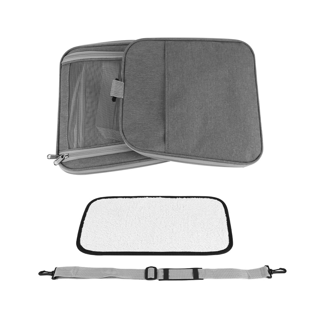 Grey foldable pet travel bag with side flap, included pad, and adjustable shoulder strap.