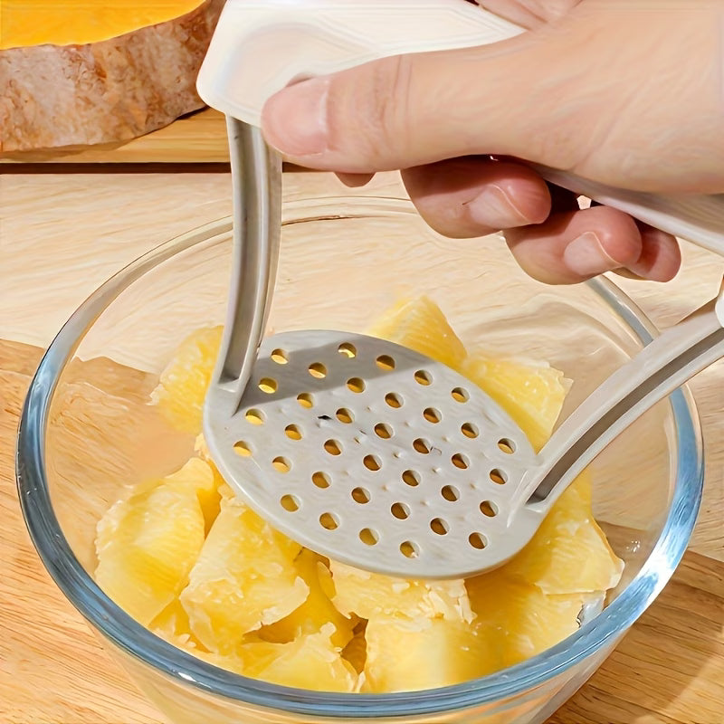 White hand grater basket with perforated plate over bowl of chopped squash