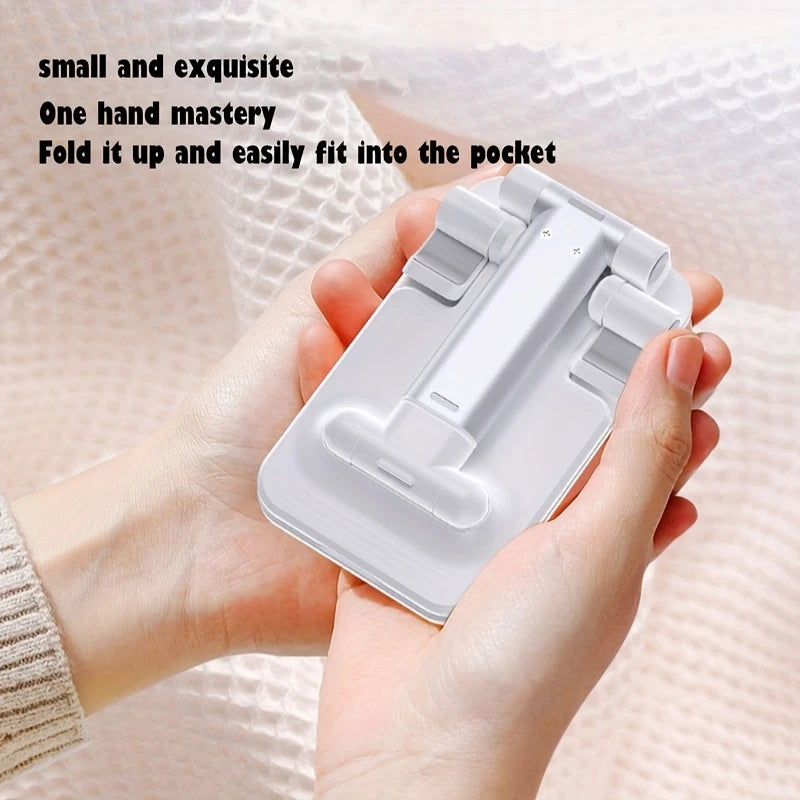 Universal foldable phone/tablet desk stand, white compact foldable holder in hand