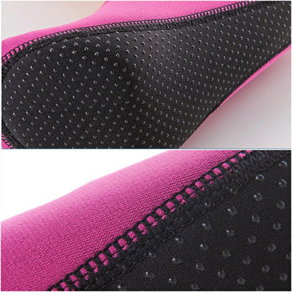 Black textured rubber sole edge of rose red water sock, side seam and grip dots
