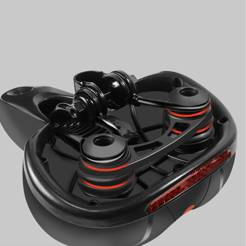 Black bike saddle base with spring rails and red stripe details, underside view