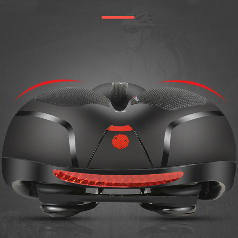 Bike saddle with red rear reflector strip and cushioned gel cutout, side rails