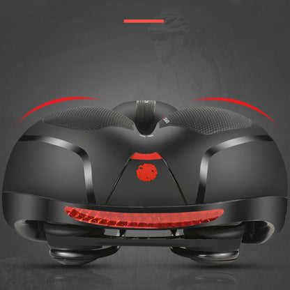 Bike saddle with red rear reflector strip and cushioned gel cutout, side rails