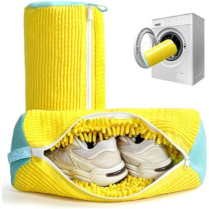 Yellow shoe washing laundry bag with fluffy interior, open top holding sneakers