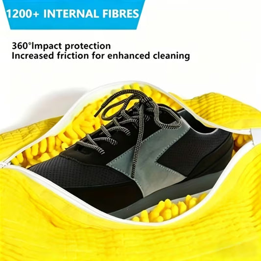 Yellow shoe washing bag with fluffy fibers holding black sneakers for machine cleaning
