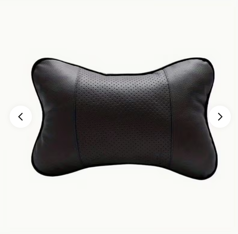 Black contoured neck pillow with perforated center and curved stitched side panels