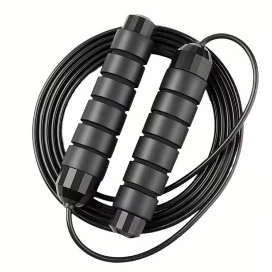 Coiled jump rope with two black padded handles and smooth bearings