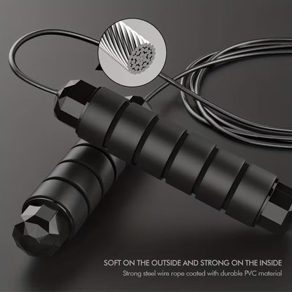 Jump rope with black foam handles and smooth ball-bearing cable, coiled