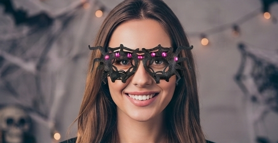 Black spider web costume glasses with bright pink gem eyes on the frame